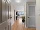 Inviting hallway leading to a bright living room with beautiful wood floors at 3481 Ne Lakeside Dr # 1508, Atlanta, GA 30326