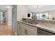 Kitchen sink and granite countertop with dining and living areas in the background at 3481 Ne Lakeside Dr # 1508, Atlanta, GA 30326