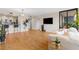Open-concept living space featuring a kitchen, wood floors, and a balcony at 3481 Ne Lakeside Dr # 1508, Atlanta, GA 30326