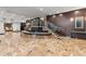 Large lobby area with marble floors, glass staircase, and paneled walls at 3481 Ne Lakeside Dr # 1508, Atlanta, GA 30326