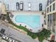 Aerial view of a community pool surrounded by lounge chairs and reserved parking spaces at 3481 Ne Lakeside Dr # 1508, Atlanta, GA 30326