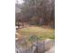 Private backyard with two metal chairs and a wooden fence at 1160 Burning Bush Dr, Loganville, GA 30052