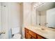 Clean bathroom with wood cabinets and a tub shower at 3614 Main Station Sw Dr, Marietta, GA 30008