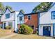 Brick front townhouse with blue door and landscaping at 3614 Main Station Sw Dr, Marietta, GA 30008