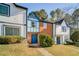 Brick front townhouse with blue door and landscaping at 3614 Main Station Sw Dr, Marietta, GA 30008
