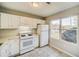 White kitchen with appliances and window view at 3614 Main Station Sw Dr, Marietta, GA 30008