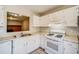 White kitchen with gas range and built-in microwave at 3614 Main Station Sw Dr, Marietta, GA 30008