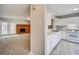 Kitchen with white cabinets and view of living room at 3614 Main Station Sw Dr, Marietta, GA 30008