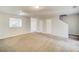 Open living room with neutral carpet and staircase at 3614 Main Station Sw Dr, Marietta, GA 30008