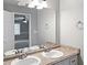 Double vanity bathroom with updated fixtures at 165 Riverbend Dr, Covington, GA 30014