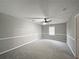 Simple bedroom with ceiling fan and neutral decor at 165 Riverbend Dr, Covington, GA 30014