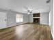 Spacious living room with fireplace and wood-look floors at 165 Riverbend Dr, Covington, GA 30014