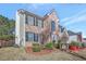 Brick and shingle two-story house with landscaping at 123 Courtneys Ln, Fayetteville, GA 30215