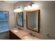 Double vanity with granite countertop and updated lighting at 1970 Wells Sw Dr, Atlanta, GA 30311
