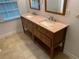 Double vanity with granite countertop and wooden base at 1970 Wells Sw Dr, Atlanta, GA 30311