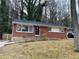 Brick ranch house with a landscaped yard at 1970 Wells Sw Dr, Atlanta, GA 30311