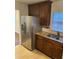 Kitchen features stainless steel refrigerator and granite counters at 1970 Wells Sw Dr, Atlanta, GA 30311