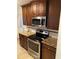Stainless steel appliances and granite countertops in the kitchen at 1970 Wells Sw Dr, Atlanta, GA 30311