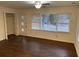 Living room with hardwood floors and large windows at 1970 Wells Sw Dr, Atlanta, GA 30311