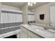 Bathroom with double vanity, marble countertop, and shower at 2652 Tilson Rd, Decatur, GA 30032