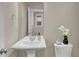 Simple bathroom with pedestal sink and toilet at 2652 Tilson Rd, Decatur, GA 30032
