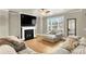 Living room with fireplace and large windows at 2652 Tilson Rd, Decatur, GA 30032