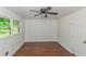 Spacious bedroom featuring hardwood floors and a ceiling fan at 1322 S Hicks Nw Cir, Conyers, GA 30012