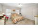 This bedroom has neutral walls, carpet and an antique dresser at 2290 Spencers Way, Stone Mountain, GA 30087