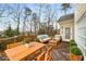 Staged wooden deck area featuring outdoor furniture and potted plants, perfect for entertaining at 2290 Spencers Way, Stone Mountain, GA 30087