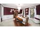 This elegant dining room features a chandelier, large windows, and seating for six at 2290 Spencers Way, Stone Mountain, GA 30087