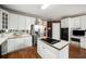 This updated kitchen has stainless steel appliances, an island cooktop, and ample storage at 2290 Spencers Way, Stone Mountain, GA 30087