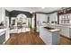 This eat-in kitchen has an island cooktop, stainless steel appliances, and modern finishes at 2290 Spencers Way, Stone Mountain, GA 30087