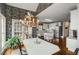 This eat-in kitchen includes an island cooktop, wooden floors, and stainless steel appliances at 2290 Spencers Way, Stone Mountain, GA 30087
