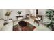 This living room area is decorated with plants, patterned chairs, and colorful rugs at 2290 Spencers Way, Stone Mountain, GA 30087