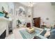 Bright living room with large windows, fireplace, and neutral decor offers a cozy and inviting space at 2290 Spencers Way, Stone Mountain, GA 30087