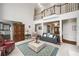 Spacious living room with high ceilings, balcony overlook, and elegant furnishings for comfortable living at 2290 Spencers Way, Stone Mountain, GA 30087