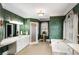 A well-lit main bathroom with white cabinetry, a garden tub, and a separate walk-in shower at 2290 Spencers Way, Stone Mountain, GA 30087