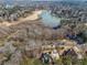 Aerial view of home, highlighting its location on a lake and golf course at 2311 Shoreline Pkwy, Villa Rica, GA 30180
