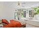 Bright basement bedroom with a window seat and ceiling fan at 2311 Shoreline Pkwy, Villa Rica, GA 30180