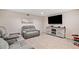Finished basement recreation area with media setup at 2311 Shoreline Pkwy, Villa Rica, GA 30180