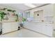 White cabinets and countertops, great for a potting area at 2311 Shoreline Pkwy, Villa Rica, GA 30180