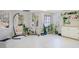 Relaxing basement sitting area with two hanging chairs and abundant plants at 2311 Shoreline Pkwy, Villa Rica, GA 30180