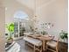 Elegant dining room featuring a large arched window and hardwood floors at 2311 Shoreline Pkwy, Villa Rica, GA 30180