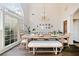 Bright dining room with hardwood floors and a large window at 2311 Shoreline Pkwy, Villa Rica, GA 30180