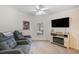 Cozy Gathering room featuring two recliner chairs, a fireplace, and a large TV at 2311 Shoreline Pkwy, Villa Rica, GA 30180