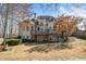 Two-story house with a deck and attached garage at 2311 Shoreline Pkwy, Villa Rica, GA 30180