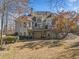 Two story house with a deck and attached garage at 2311 Shoreline Pkwy, Villa Rica, GA 30180