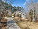 House with stone accents and a long driveway at 2311 Shoreline Pkwy, Villa Rica, GA 30180