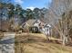 House with stone accents and a long driveway at 2311 Shoreline Pkwy, Villa Rica, GA 30180