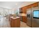 Open kitchen with island, stainless steel appliances, and lots of light at 2311 Shoreline Pkwy, Villa Rica, GA 30180